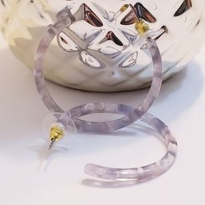 Small gray and clear acrylic hoops